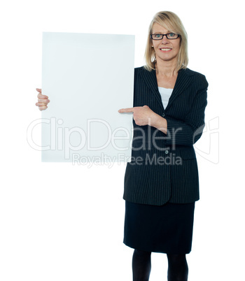 Business woman displaying placard to camera