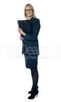 Corporate woman holding business documents