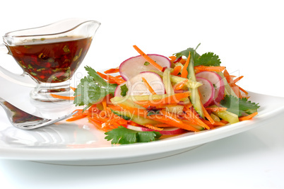 Salad with carrot, cucumber and radish