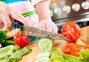 Woman's hands cutting vegetables