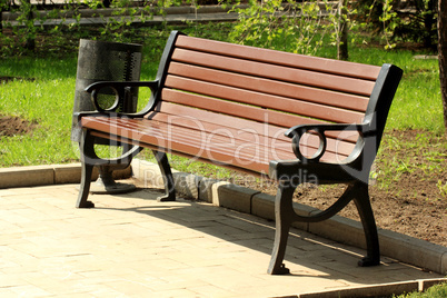 Wooden benches against the background of green grass