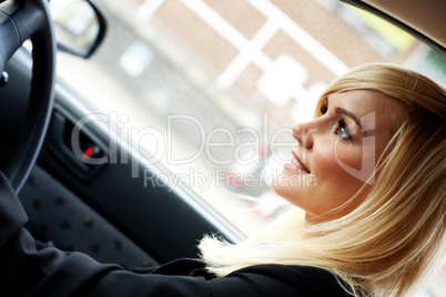 Beautiful businesswoman driving a car