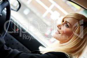 Beautiful businesswoman driving a car