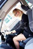 Beautiful businesswoman driving a car