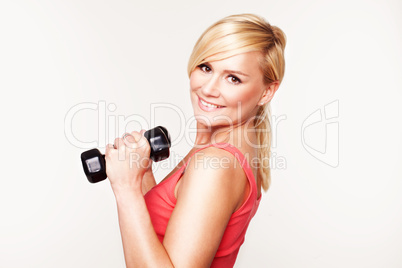 Pretty girl keeping her beautiful shape exercising