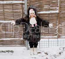 little girl at fence