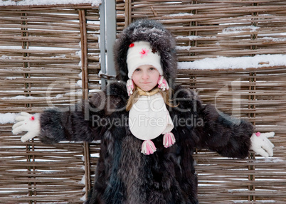 little girl at fence