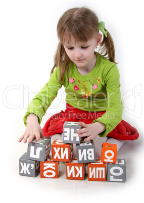 girl play with bricks