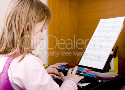 girl playing at piano