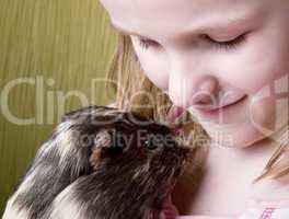 little girl and her guinea pig