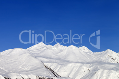 Snowy mountains and blue sky