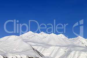 Snowy mountains and blue sky