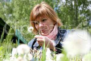 woman and dandelion