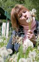 woman and dandelion