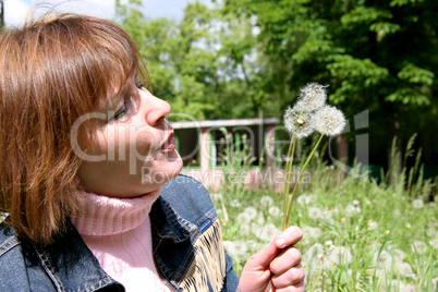 woman and dandelion