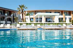 Swimming pool by a beach at the modern luxury hotel, Pieria, Gre