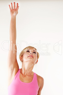 Young woman stretching her hand into the air