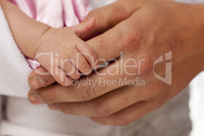 Baby Girl Hand Holding Rough Finger of Dad