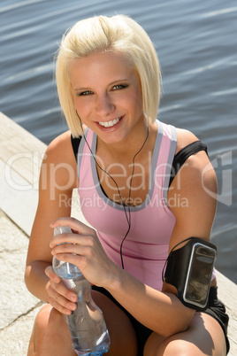 Sport woman smiling relax water sitting pier