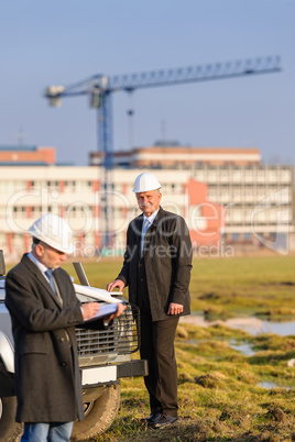 Architect man make notes on construction site