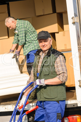 Mover two man loading furniture on truck