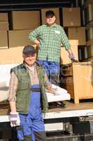 Mover two man loading furniture and boxes