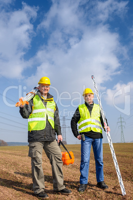 Geodesist two man equipment on construction site