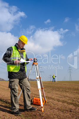 Geodesist measure land look construction plan