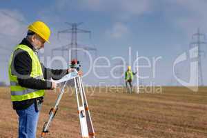 Geodesist measure land on construction site