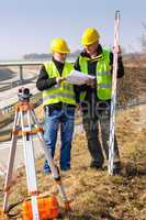 Geodesist read plans on construction site