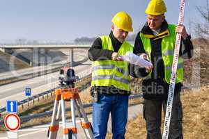 Geodesist read plans on construction site