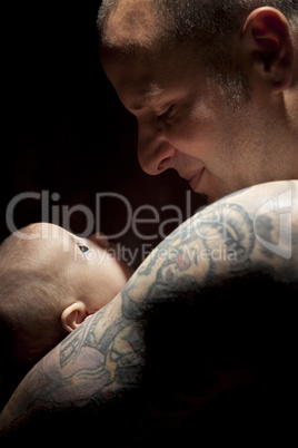 Young Father Holding His Mixed Race Newborn Baby