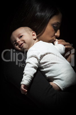 Ethnic Woman Kisses Her Newborn Baby Hand