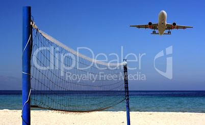 Jet flying over Volleyball net on an empty beach