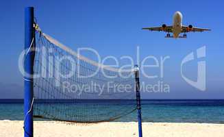 Jet flying over Volleyball net on an empty beach