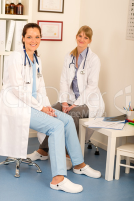 Two female doctor sitting surgery office