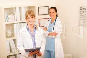 Two female doctor standing at medical office