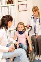 Young girl on wheelchair visit doctor
