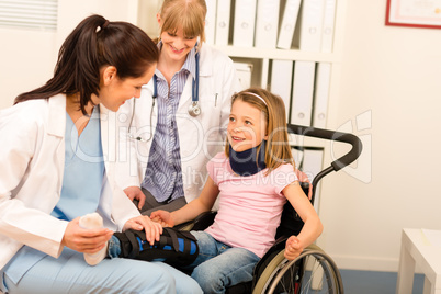 Young girl on wheelchair visit doctor