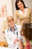 Pediatrician with little girl and mother