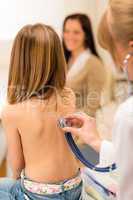 Pediatrician check child back with stethoscope.