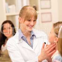 Pediatrician examine child throat cold prevention