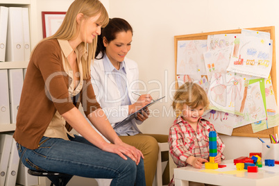 Pediatrician observe child girl play at surgery