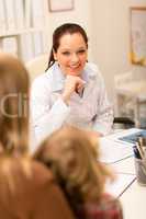 Mother and child girl visit pediatrician office