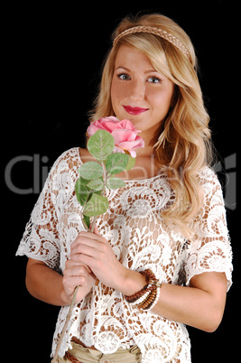 Lovely girl with pink rose.