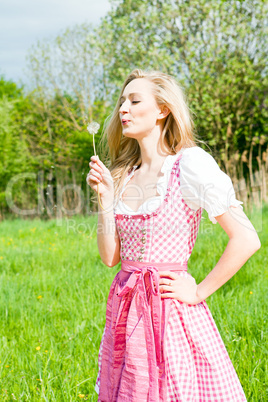 young woman with pink dirndl outdoor