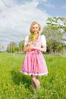 young woman with pink dirndl outdoor