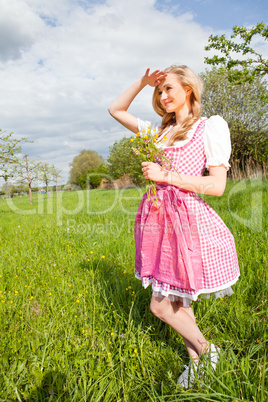 young woman with pink dirndl outdoor