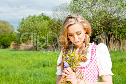 young woman with pink dirndl outdoor