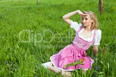 young woman with pink dirndl outdoor